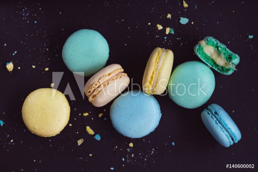 Picture of Macaroons on dark background colorful french cookies macarons The broken macarons with crumbs